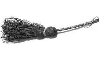 A besom broom: a bundle of birch twigs bound to a wooden handle