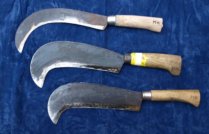 Three billhooks of different regional patterns