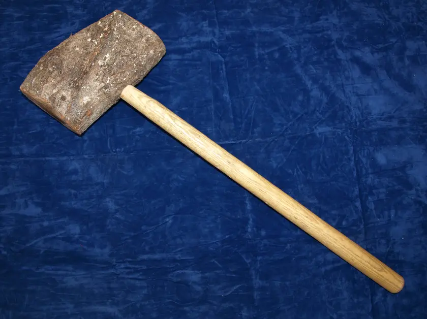 A maul: a heavy wooden hammer with a long handle